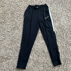 Nike dri-fit sweats. Zipper bottoms.